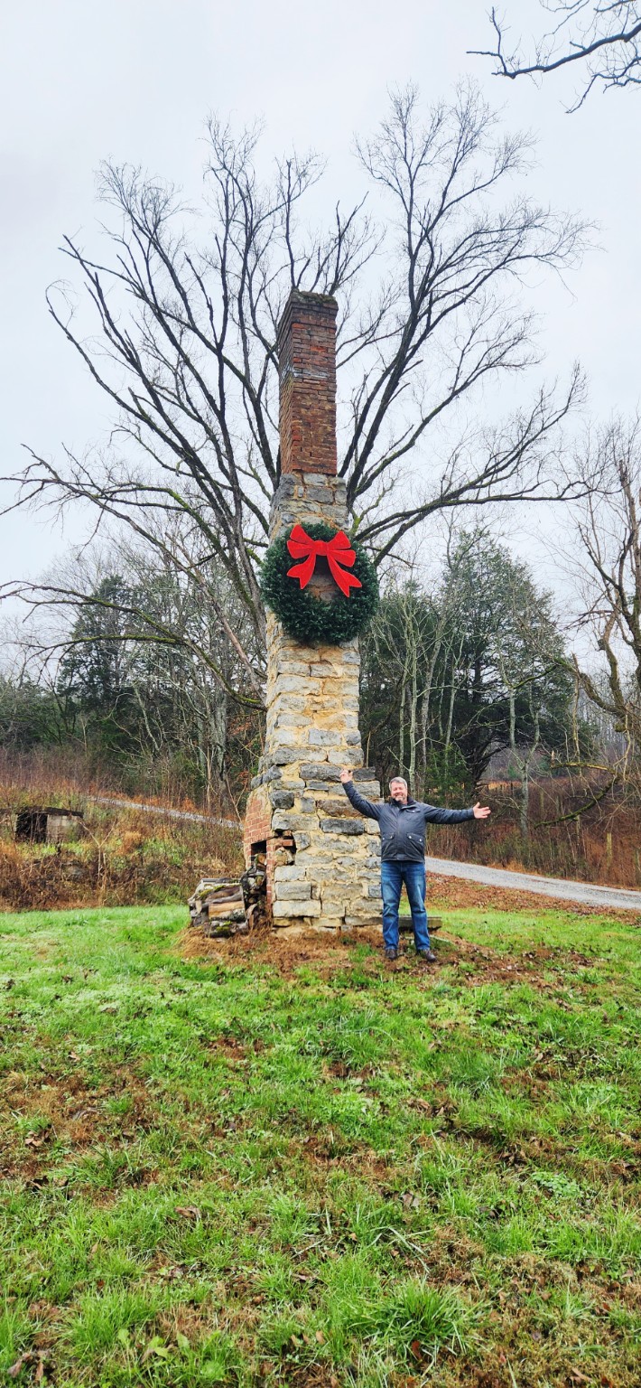 The chimney landmark with a person standing beside it